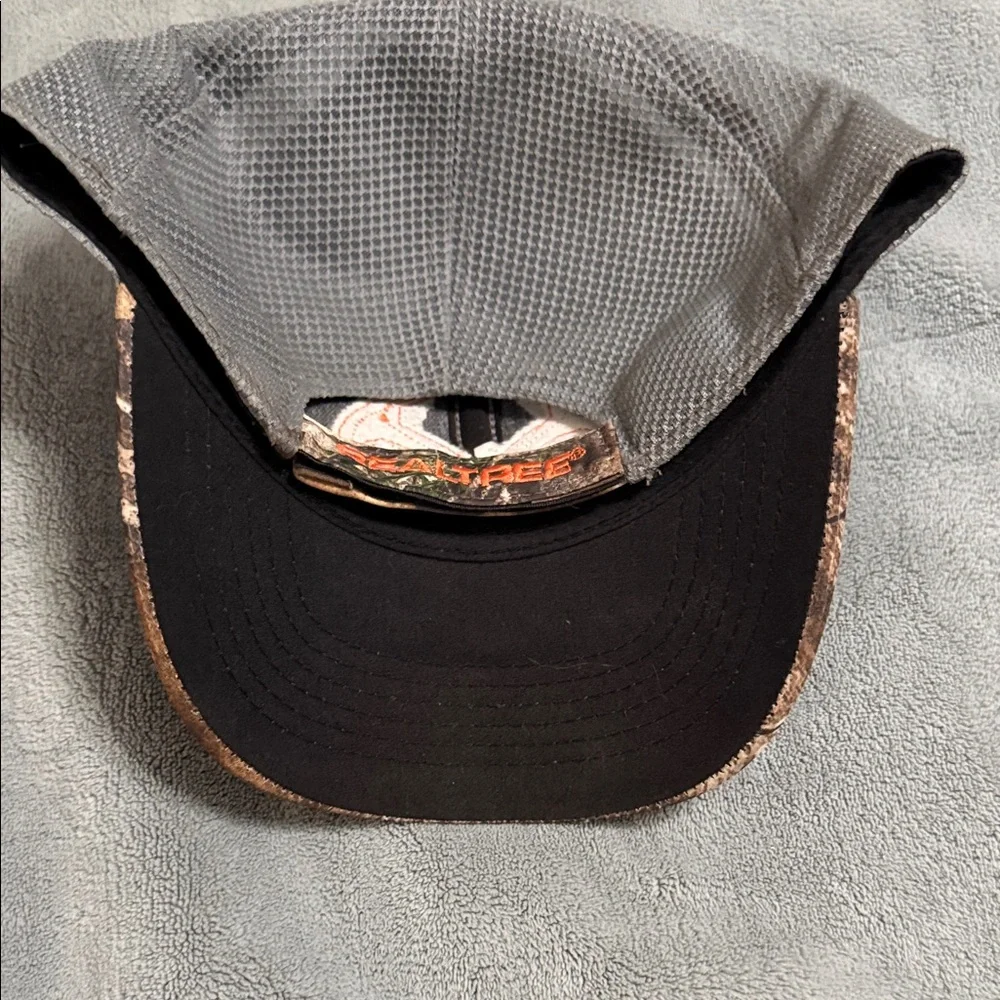 Realtree Camouflage Hat with Vibrant Orange Emblem